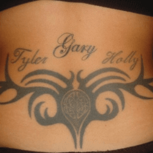Design on my lower back with my husbands name and my tein daughters names