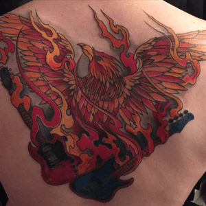 An ode to my rebirth to music after a long hiatus and to the very special lady that first taught me to play. A custom design featuring a Phoenix carrying two of my own guitars. 