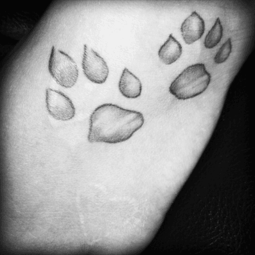 Tattoo uploaded by Sylvia C. • Childhood dog's paw prints and a brand from many moons ago. #pawprints #bestdog #brand #hearts #Scarification 101463 • Tattoodo