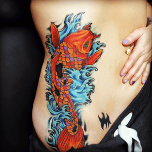 Tattoo by Jeremy Crawford. IG: @jeremywcl FB: Tattoos by Jeremy Crawford. Find more here on this account! #color #koi #alabama #sacredarttattoos #side #ribs #water #detail #jeremycrawford #girlswithtattoos #linework #gadsden #shading 