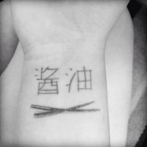 Soy sauce in chinese writing with chop sticks on my wrist!