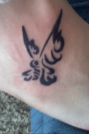 Tribal butterfly on my right foot.