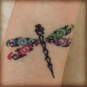 This dragonfly represents my 4 nieces and nephews, one wing for each child 