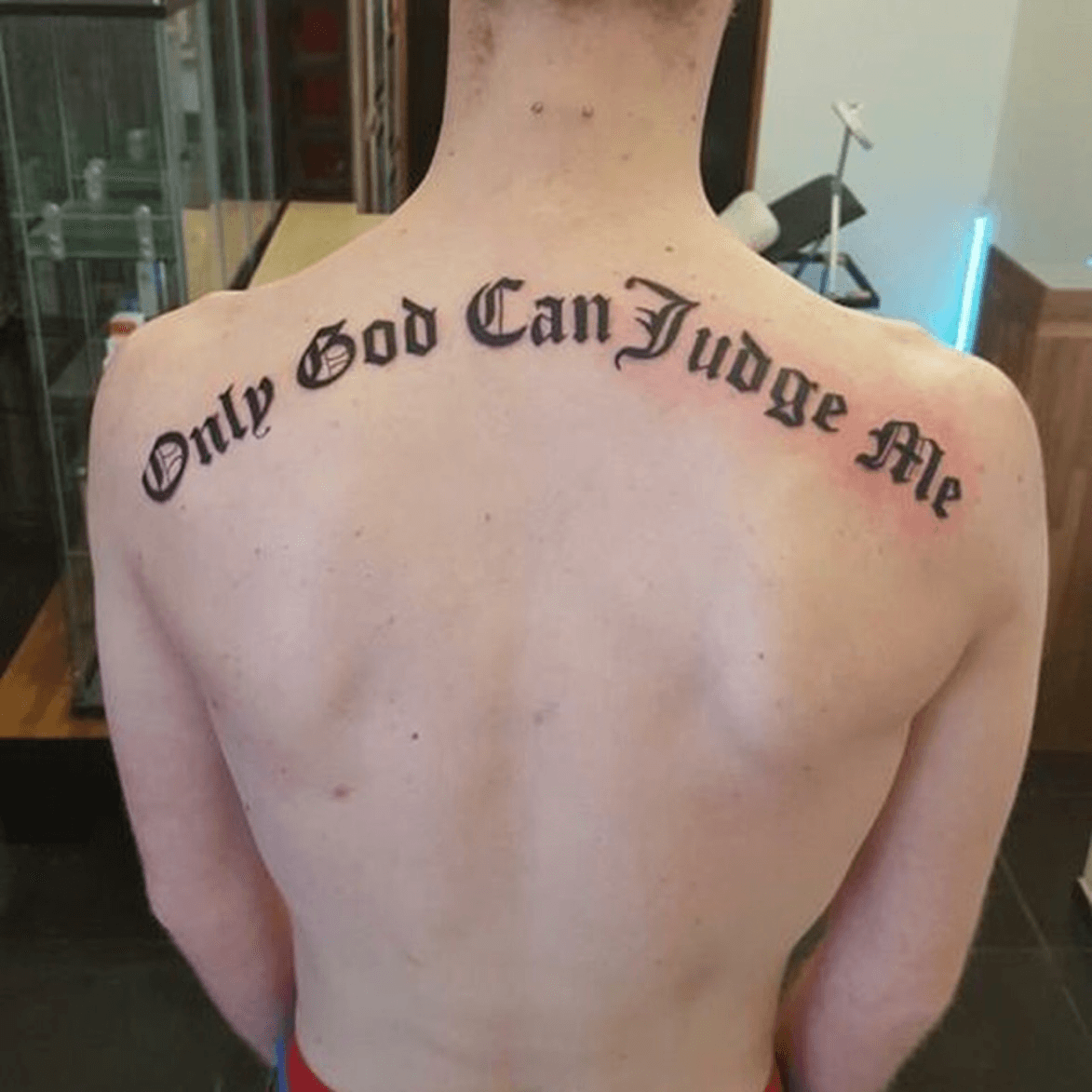 Only god can judge me back tattoo