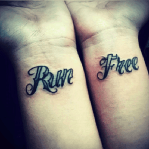 I am in love with my wrist tattoos. It means never give up. Everyone is able to run free and be free from anything that will ever keep them from being happy. Lie a wolf. Run free. Youll be happy once you are gone from all the bad in life. I always look at this tattoos when i am down. Makes me feel better. 