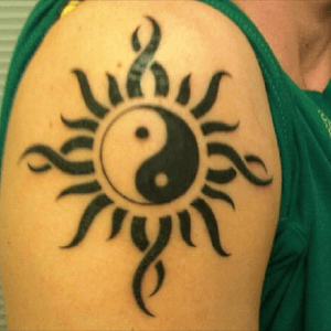 Godsmack sun/yin yang combo, my first tattoo. I believe strongly in the concept of yin & yang, and Godsmack got me through some tough times in my life. My first tattoo, I got this back in August 2010.