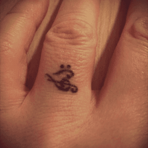 My first tattoo, on my wedding ring finger. 