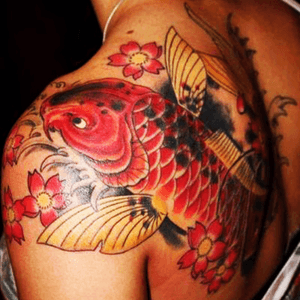 I would love to have a giant koi (or two) covering the lower half of my back...I need a scorpion and crab in there somehow too...#dreamtattoo