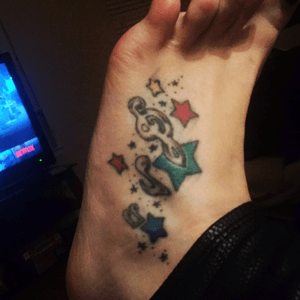 This was my third tattoo. I love stars and i love music. I designed this myself. 