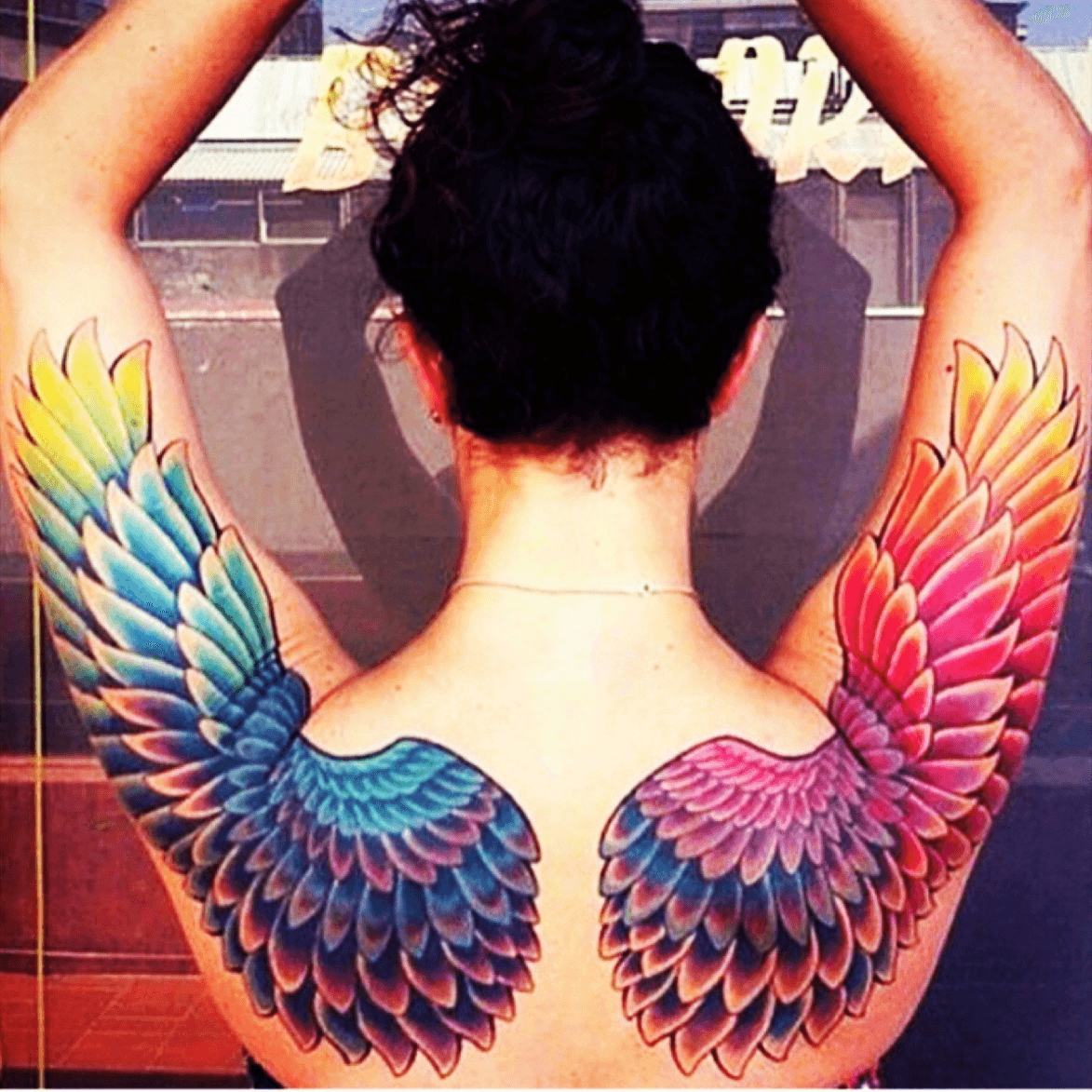 watercolorbackshouldertattooheaventattooscolorsoftherainbowreddressblackbackground   Wings tattoo Angel wings tattoo Heart with wings tattoo