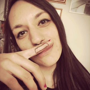 My sister with a bobs burger mustache tattoo