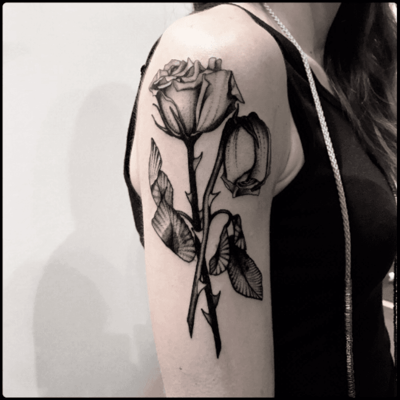 Upside down rose bouquet tattoo on the right side