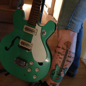 My boyfriends guitar he made.... He was in a fatal motorcycle accident and i wanted a memory on my body to cherish him forever