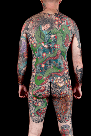 Immerse in traditional Japanese art with this detailed body suit featuring dragons, flowers, sakura, geishas, samurais, women, and men. Masterfully inked by renowned artist Stewart Robson.