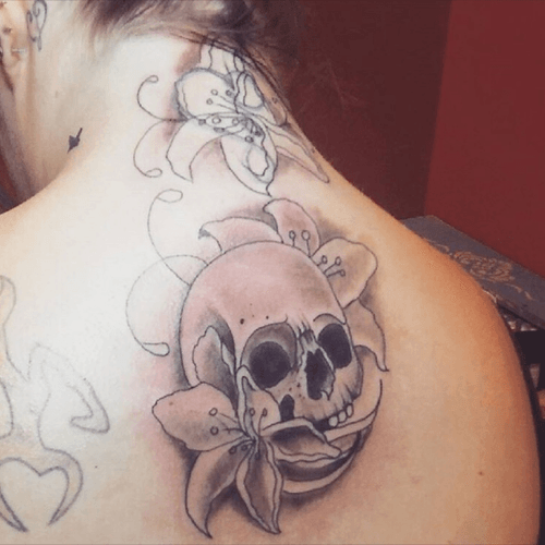 this was in the process of covering my neck tattoo and adding this amazing skull underneath about 3 months ago. cant find the picture when it was completely finished. may be an odd placement, but will look even better when my entire back is finished in a few months.