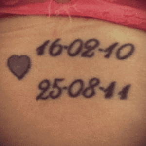 My fourth tattoo. My niece and nephew's birth dates. I was at their births, so those dates mean alot to me. The little purple heart is from my sister 💜