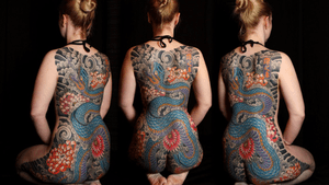 Elegant body suit showcasing a Japanese style snake and chrysanthemum design by renowned artist Stewart Robson.
