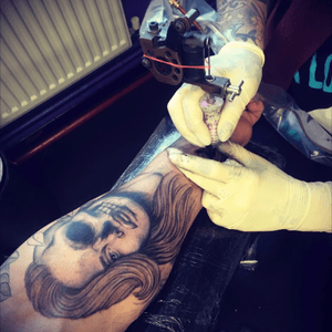 Rest of the sleeve is in progress! #tattooshed #forearmtattoo #blackandgrey #face #rose #skull #guyswithink #sleeve #fullsleeve 