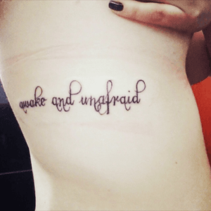 On my ribs I have Awake and Unafraid, taken out of My Chemical Romance's Famous Last Words.