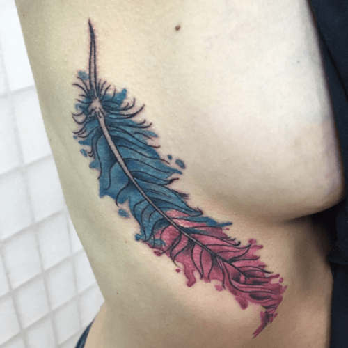 Colorful feather #color #ribtattoo #sidetattoo #colortattoo #tattoo #tattoos #tattooart #tattooartist #tattooshop #feathertattoo #feather #neworleans 