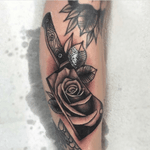 Custom cross over style tattoo i made. Realism rose with bold traditional cleaver and leaves #realism #blackandgrey #traditional #neotraditional 