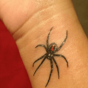 Right wrist...my black widow. A reminder that as a woman i dont always need a man lol. 