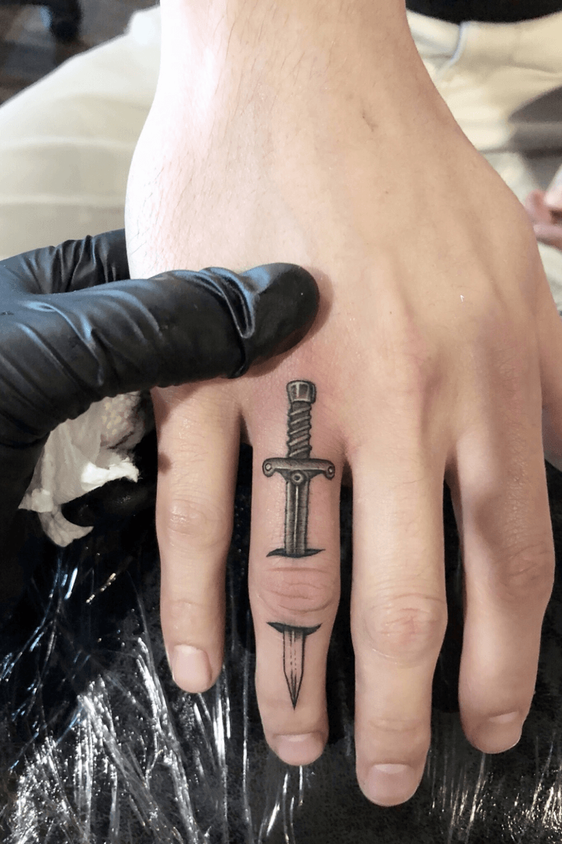 Tattoo uploaded by JoJo • finger tattoo sword fingertattoo 