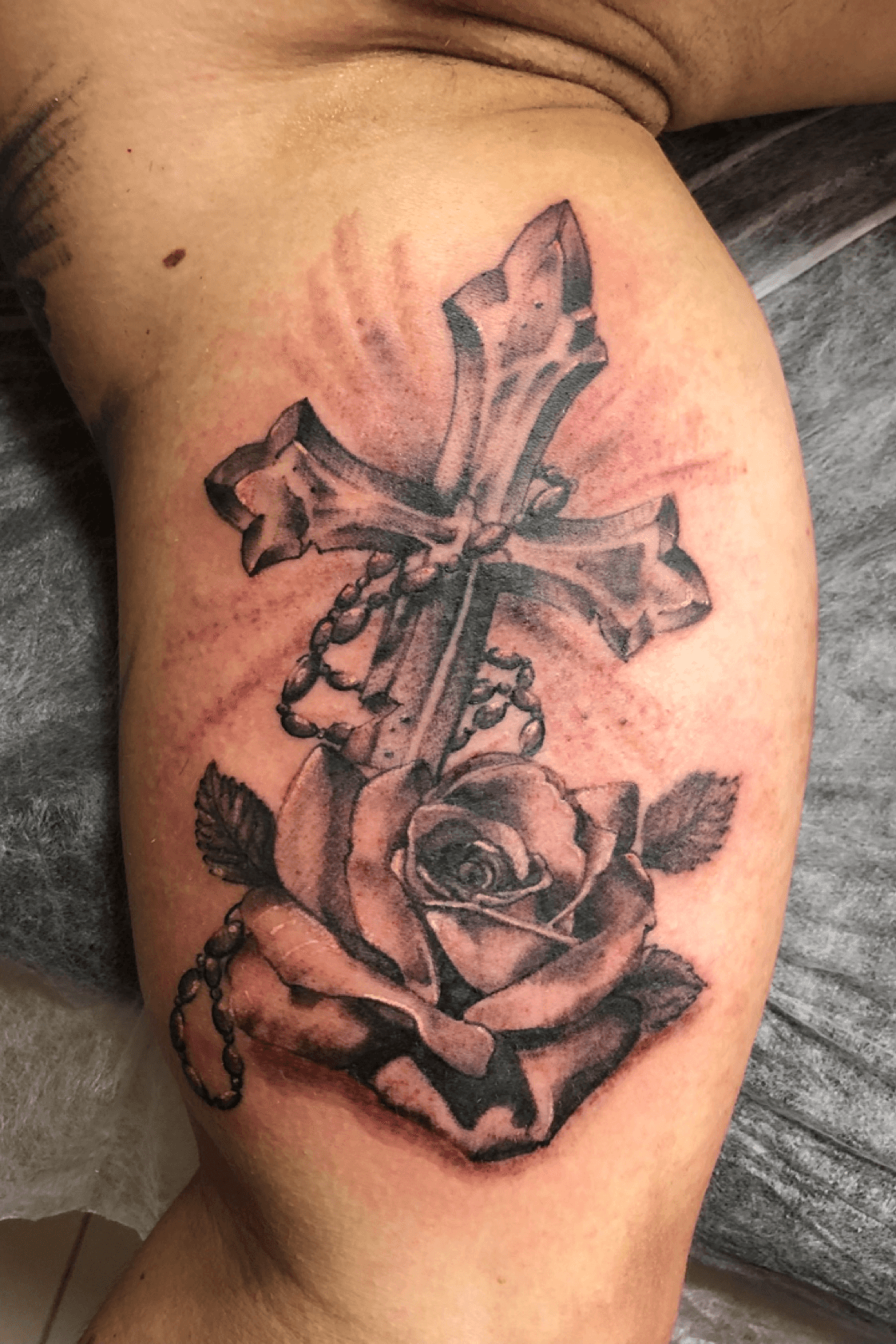 cross and rose tattoos with banner