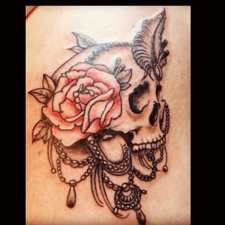 Tattoo uploaded by Zara  skull rose feather jewels  Tattoodo
