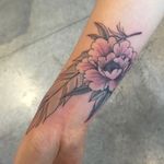 Pure and simple #peony and #feather tattoo on the wrist by Dave Robinson  #seventhsontattoo #seventhson #peony #wrist  #sanfrancisco 