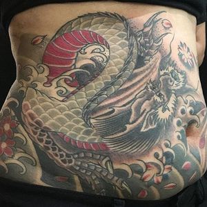 Dragon tummy  by Gentleman Joel Get zapped at Chicago Tattoo Company. Open 12-Midnight. 7 Days a week! #stomachtattoo #dragontattoo #japanesetattoo #chicagotattooartist #chicagotattooshops #dragon