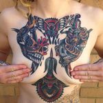 That sexy valley between the breasts is a good place to start. Tattoo by James McKenna.