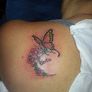 Foxy piercing tattoo