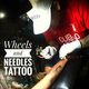 Wheels and needles tattoo