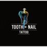 Tooth and nail tattoo