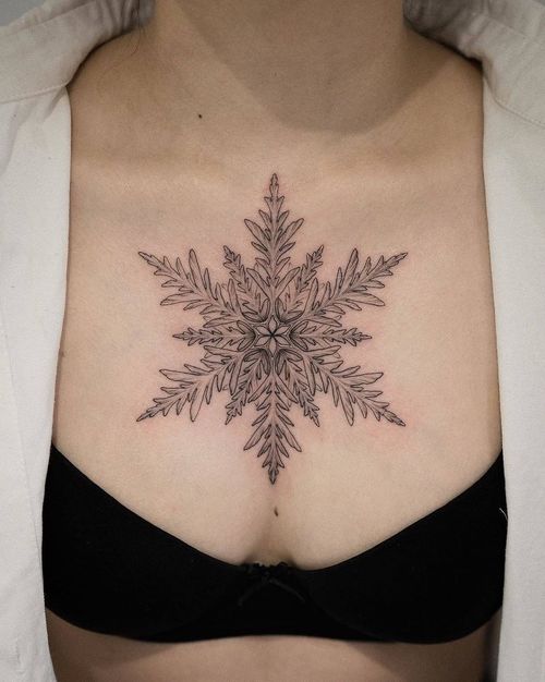 Chest tattoo by Intat #Intat #chesttattoo #sternumtattoo #chestpiecetattoo #fineline #illustrative #snowflake #snow #frost