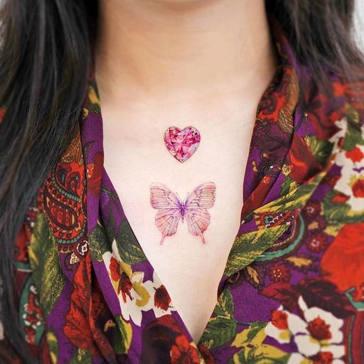 Chest tattoo by Song E #SongE #chesttattoo #sternumtattoo #chestpiecetattoo #butterfly #gem #diamond #butterfly #color #realism #realistic