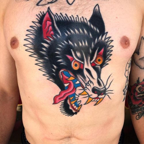 Chest tattoo by Jeff Sypherd #JeffSypherd #chesttattoo #sternumtattoo #chestpiecetattoo #traditional #color #wolf