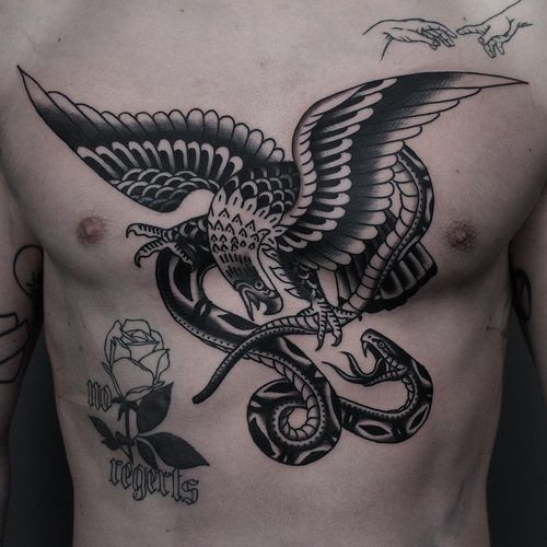 Chest tattoo by Tony Bluearms #TonyBluearms #chesttattoo #sternumtattoo #chestpiecetattoo #traditional #blackwork #eagle #snake #fight