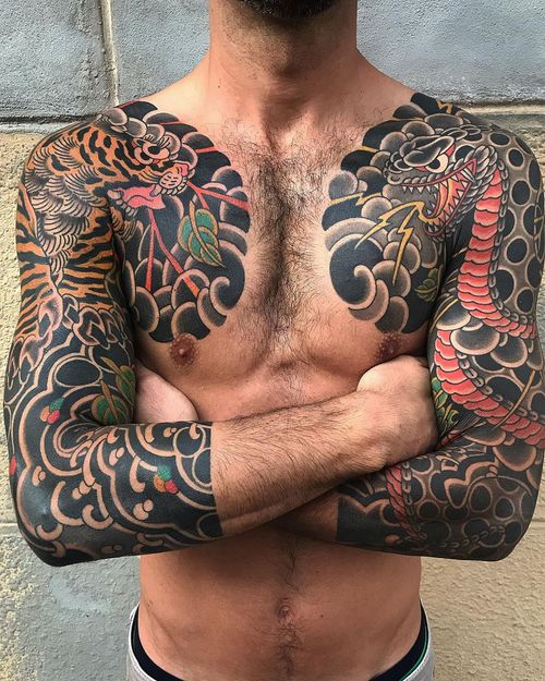 Chest tattoo by Koji Ichimaru #KojiIchimaru #chesttattoo #sternumtattoo #chestpiecetattoo #Japanese #tiger #snake #cobra #clouds #lightning