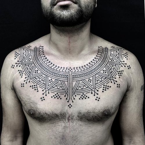 tribal wings chest tattoo