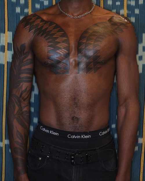 Chest tattoo by Victor J Webster #VictorJWebster #chesttattoo #sternumtattoo #chestpiecetattoo #blackwork #tribal #shapes #abstract #pattern