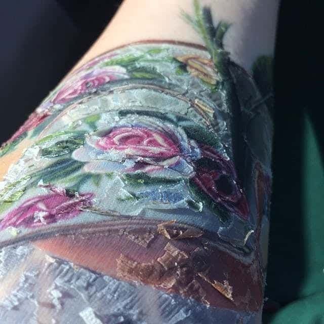 A color rose tattoo flaking as it heals.